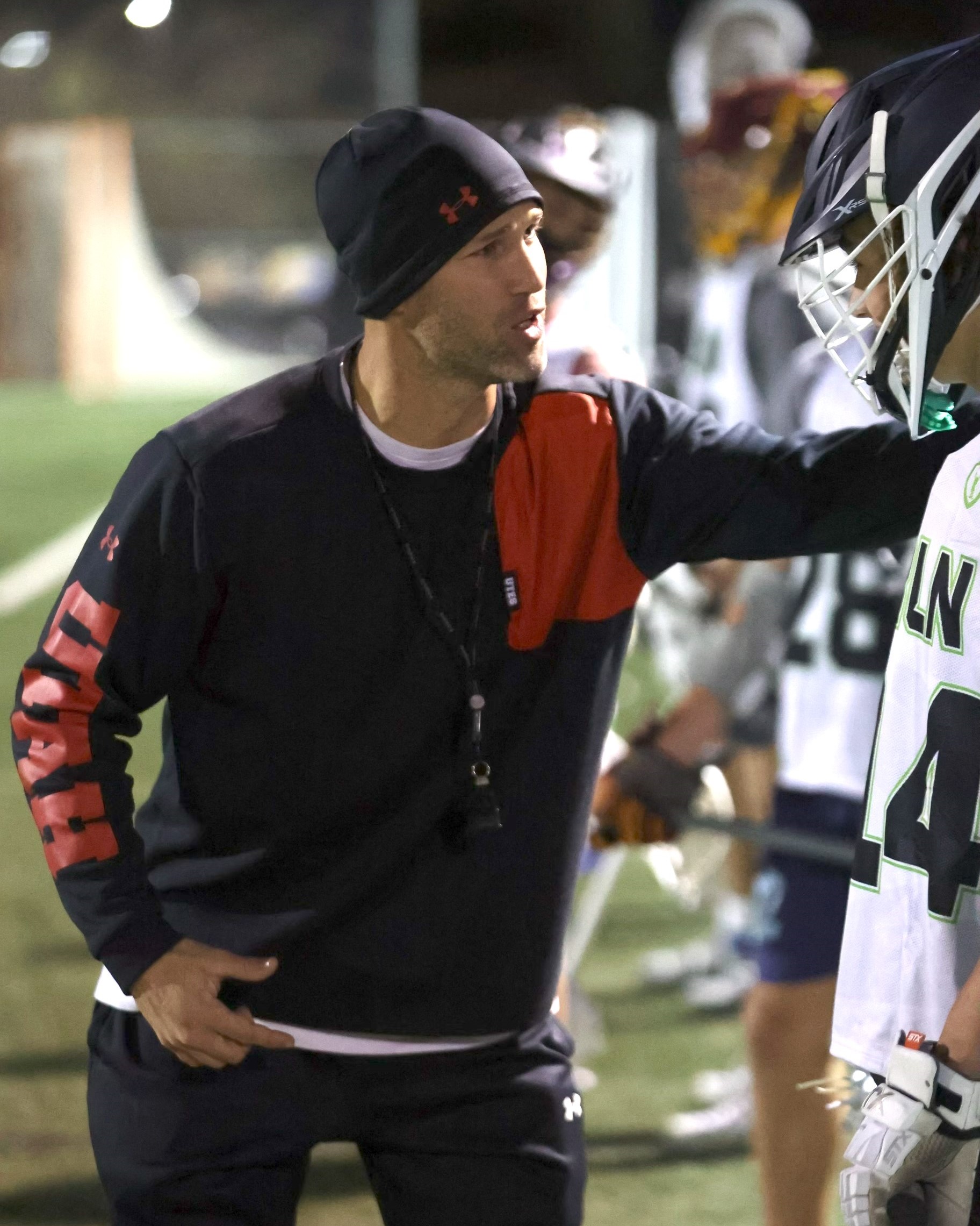 Coach McDermott working with a player